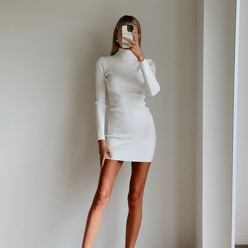 Female model wearing white high neck long sleeve bodycon mini dress